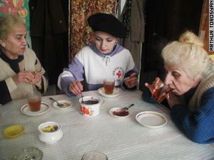 Tea time for volunteer and her elderly friends